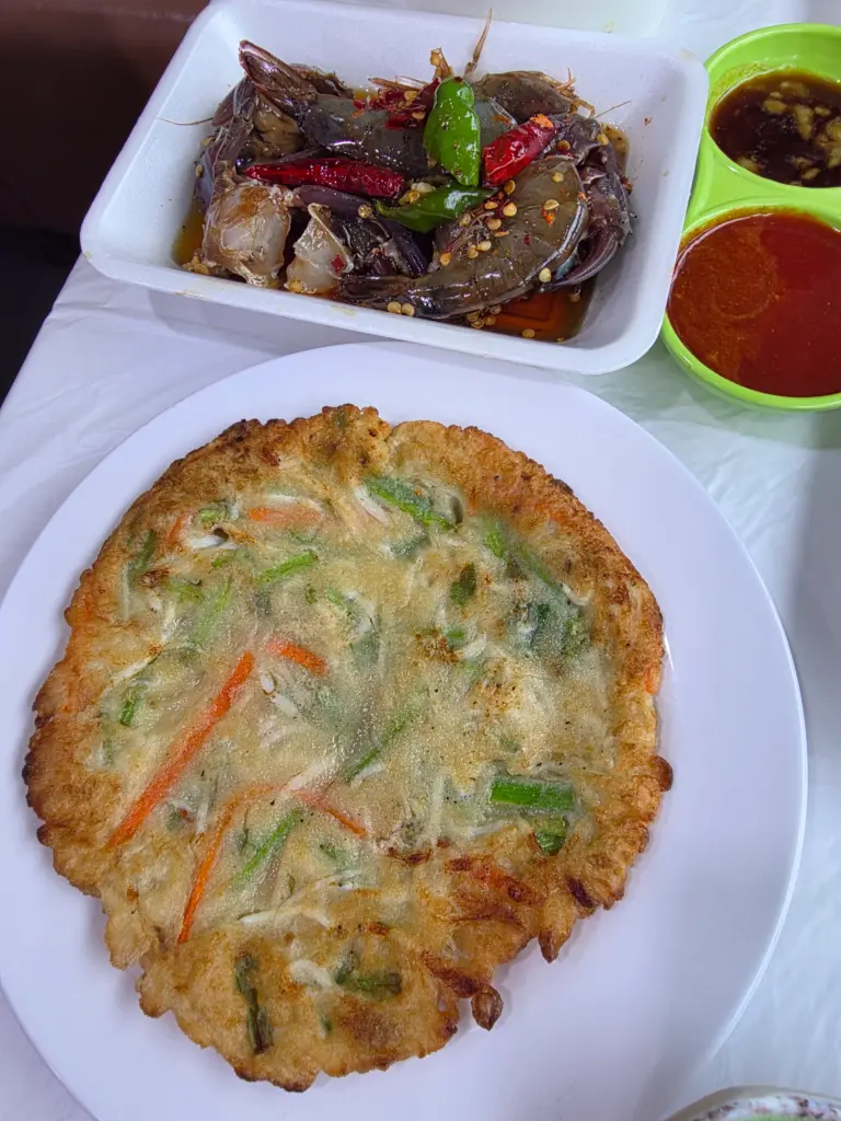 Soy-marinated crab and Korean pancake served at Jango Port Silchi Festival